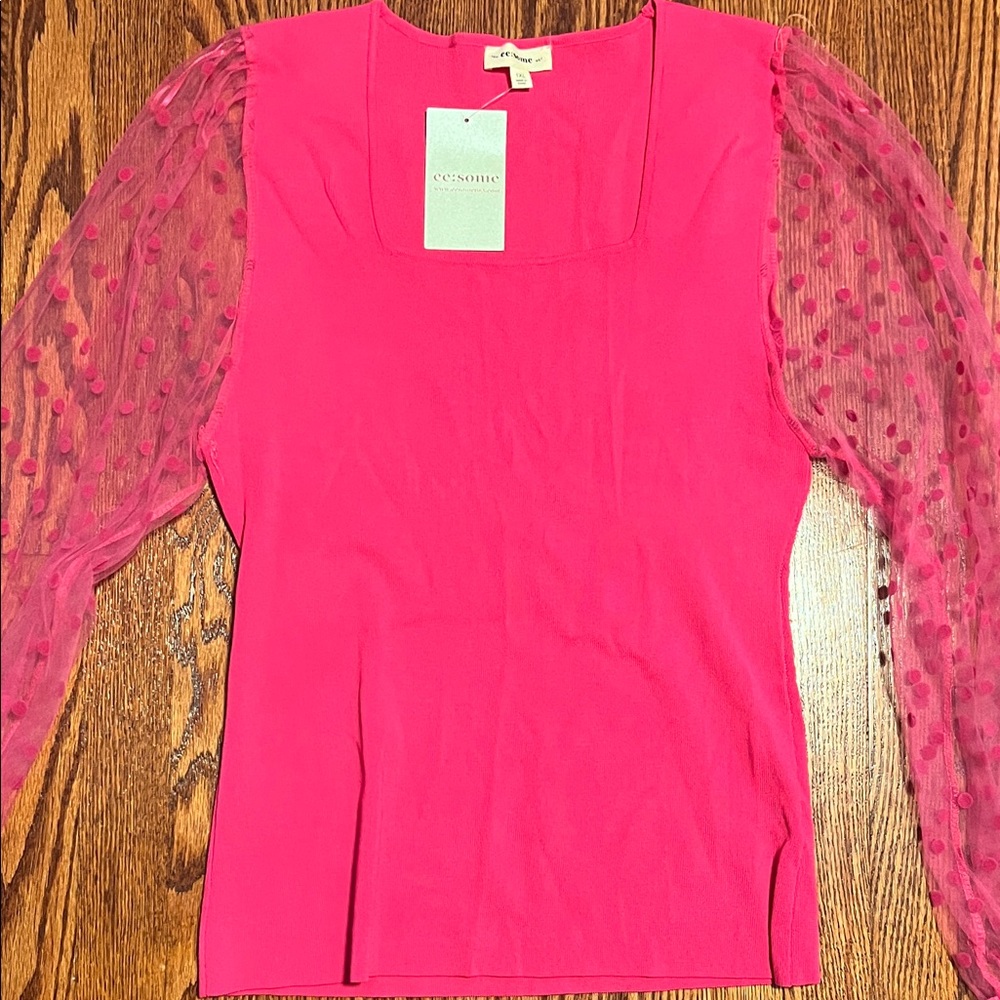 Pink blouse with sheer polka dot sleeves